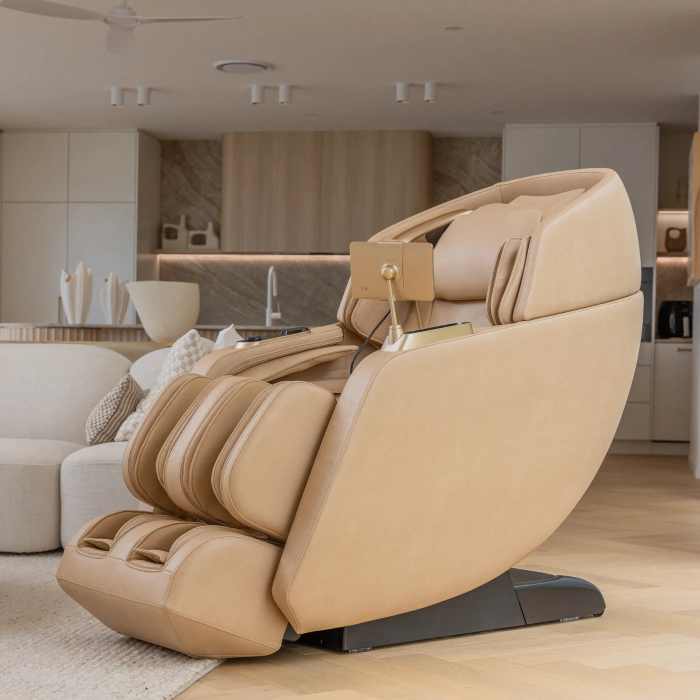 Therapi + massage chair in soft beige leather with sleek black details, 2025 award-winning model.